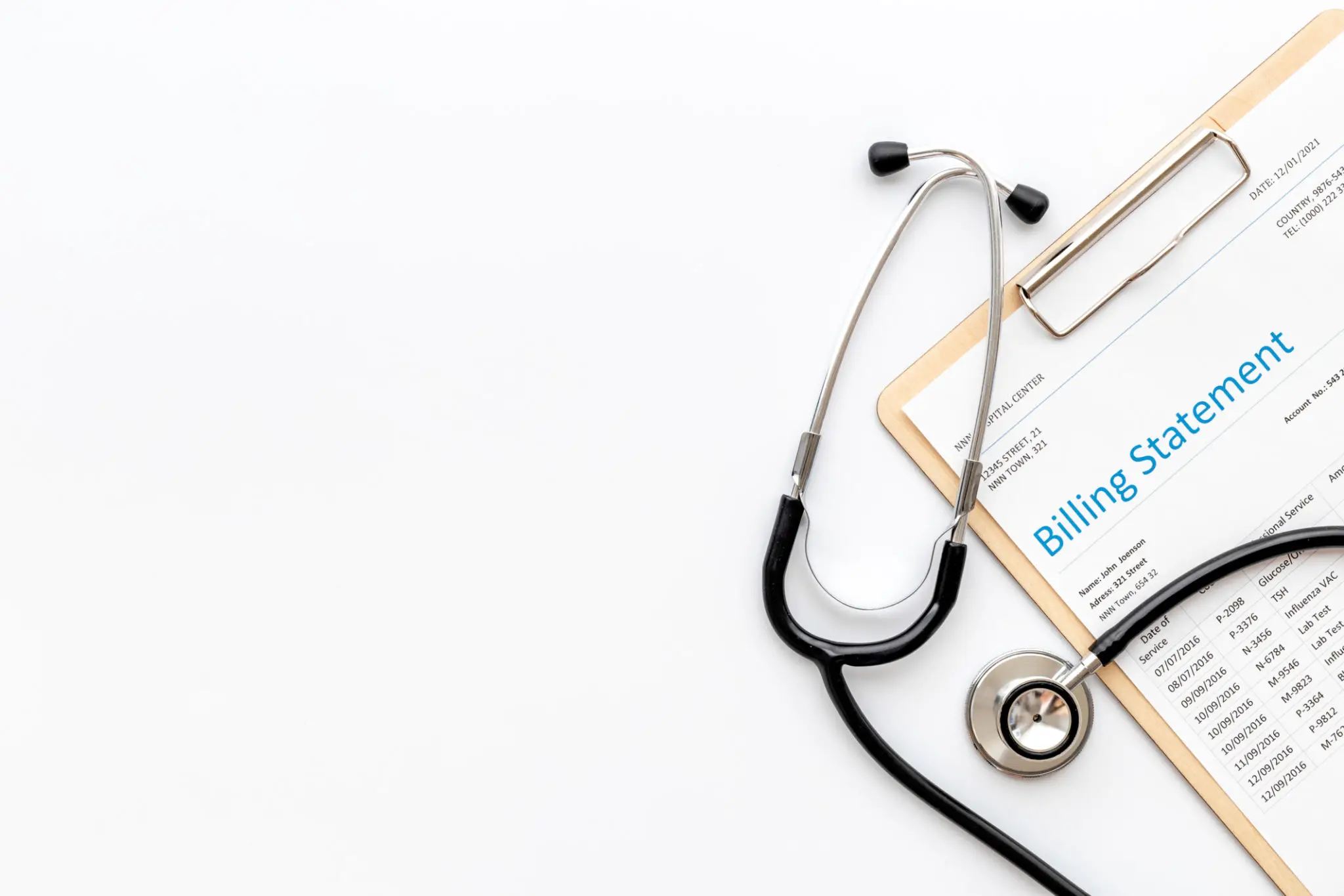 Stethoscope and billing statement on clipboard.