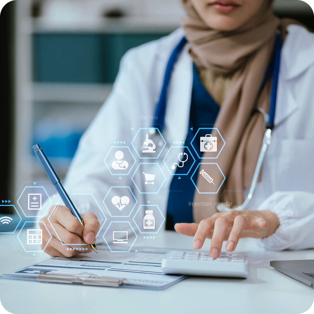 Doctor using technology and writing on paper.